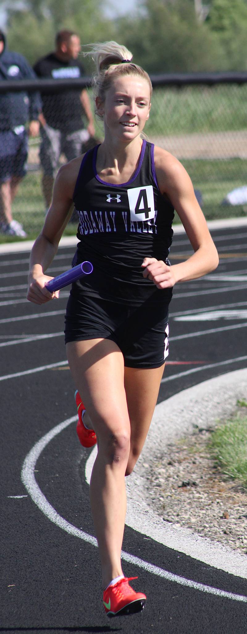 NV junior Izzy Eisbach runs a leg of the Wolverines' sprint medley relay at the state-qualifying meet at Madrid.
