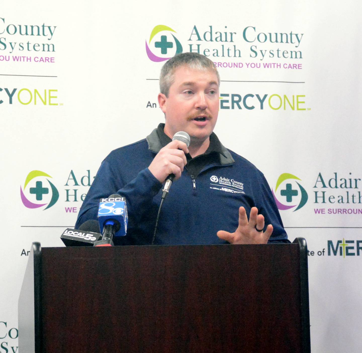 Adair County Health System's EMS Manager Chris Roberts speaks during the ribbon cutting program for the new EMS House.