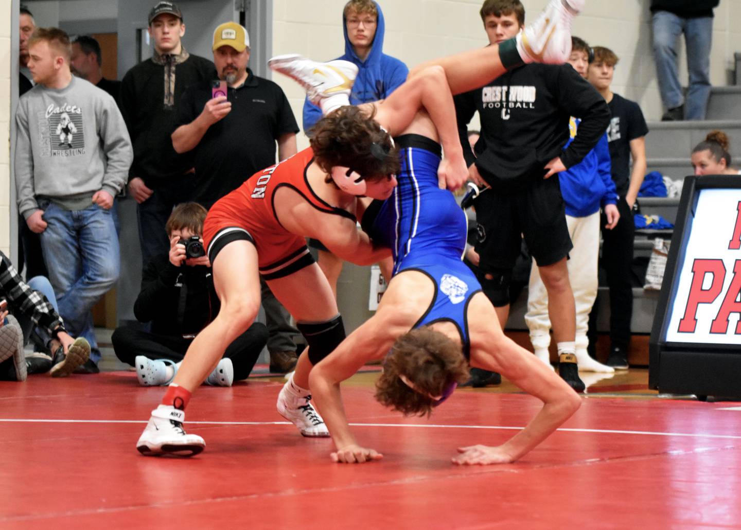Creston’s Ben James throws Noah Bergan of Crestwood in the 113-pound third-place match Saturday at the Panther Invitational. James won the bout 12-2.