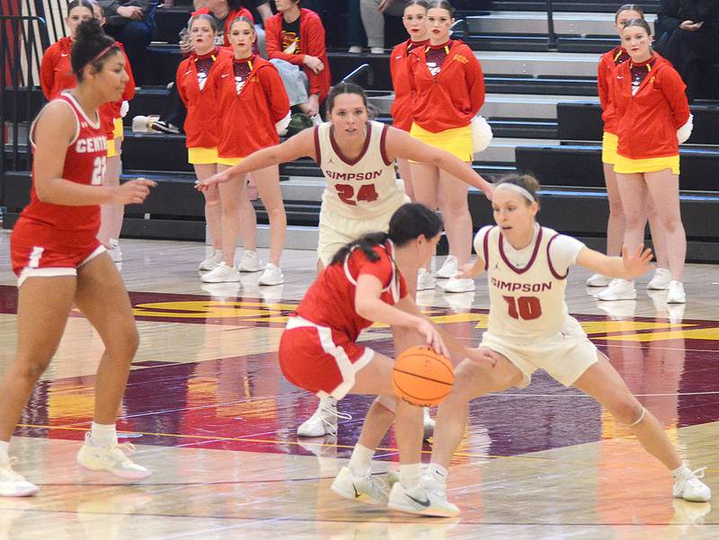 Simpson players Maddax DeVault (10) of Greenfield and Doryn Paup (24) of Simpson College defend Central College players during Wednesday's game.