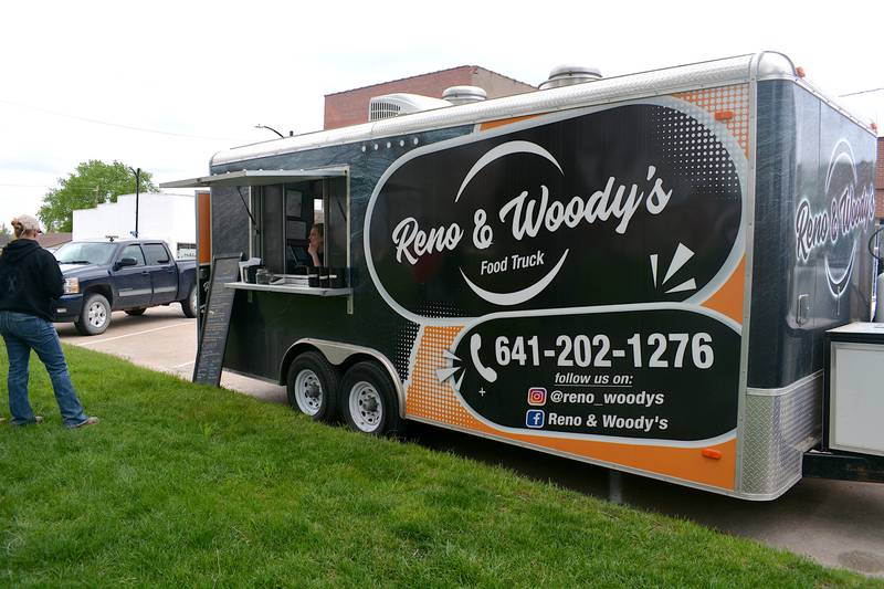 The Reno & Woody's food truck serves meals in the Afton square park during the power outage Saturday, April 27.