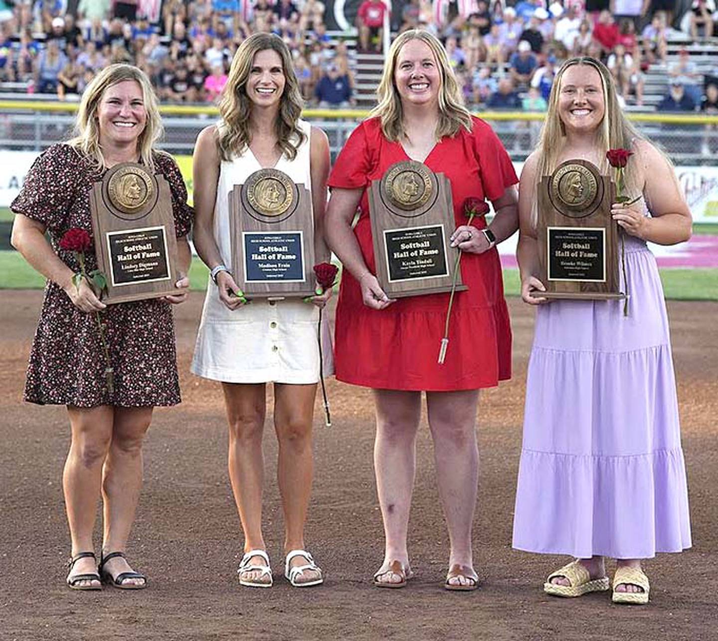The 2025 Softball Hall of Fame class includes, from left, former Linn-Mar shortstop Lindsey Digmann, former Creston pitcher Madison (Frain) Peterson, former Akron-Westfield pitcher Kayla Tindall and former Johnston shortstop Brooke Wilmes.