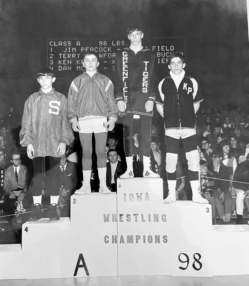Greenfield's Jim Peacock stands atop the medal podium at the state tournament in 1970. He is Greenfield's first state wrestling champion.