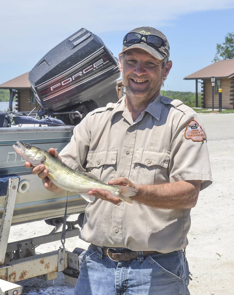 Doug Jones presents his catch of the day. Jones will retire from Union County Conservation next month.