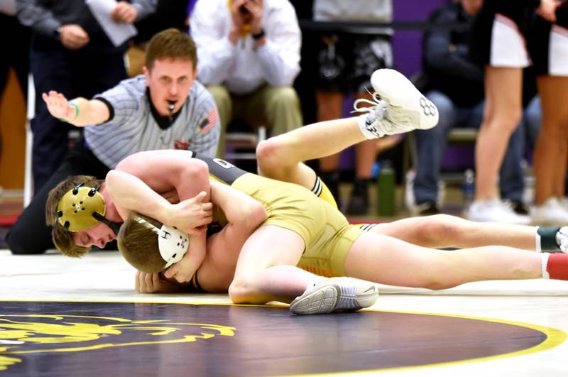 Creston freshman Colt Key holds state-ranked Keaton Schroeder of Atlantic to the mat in the 106-pound championship match Saturday at the Hawkeye 10 meet in Denison. Key placed second in his weight class.