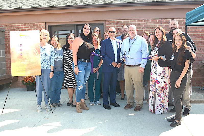 Adair Chamber of Commerce members join Ivory Plains Recovery Center officials for their ribbon cutting Tuesday, Sept. 12 in Adair.