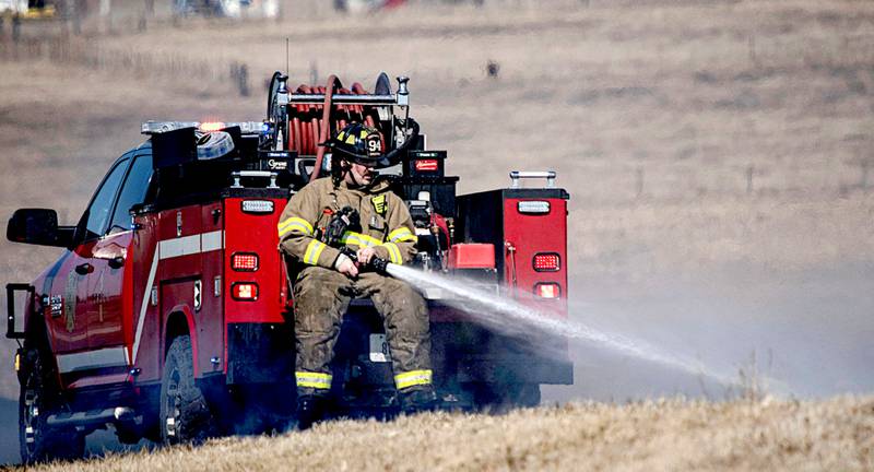 Creston Fire Department works a grass fire earlier this month. Dry conditions have implemented a burn ban in Union County beginning Monday.