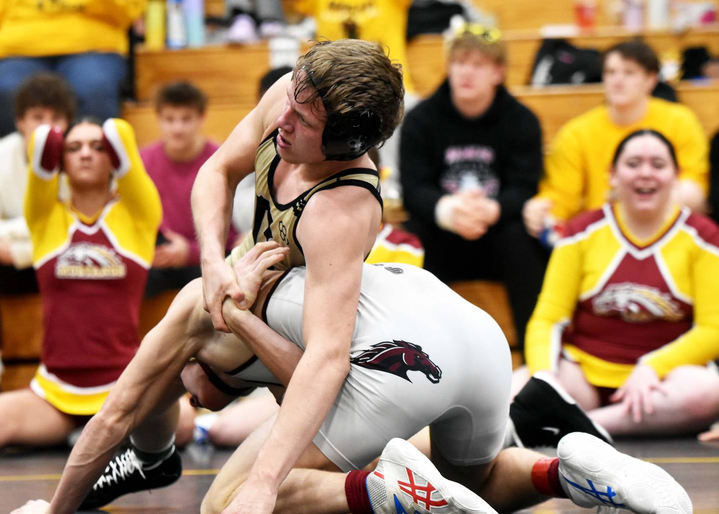 Austin Evans holds Tucker Wheeler of PCM in the finals.