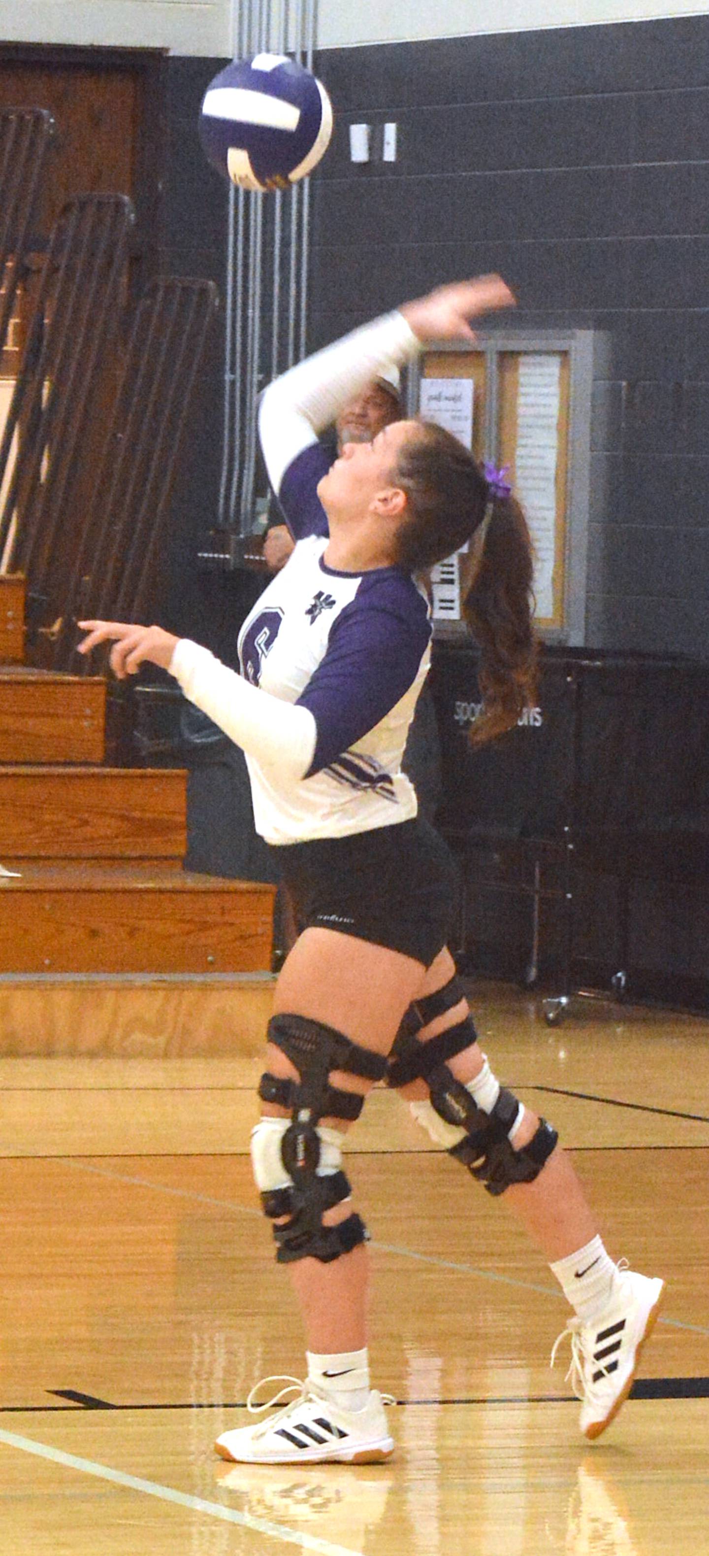 Wolverine senior Caroline Britten serves the ball against Atlantic last Thursday in non-conference volleyball action at Greenfield.