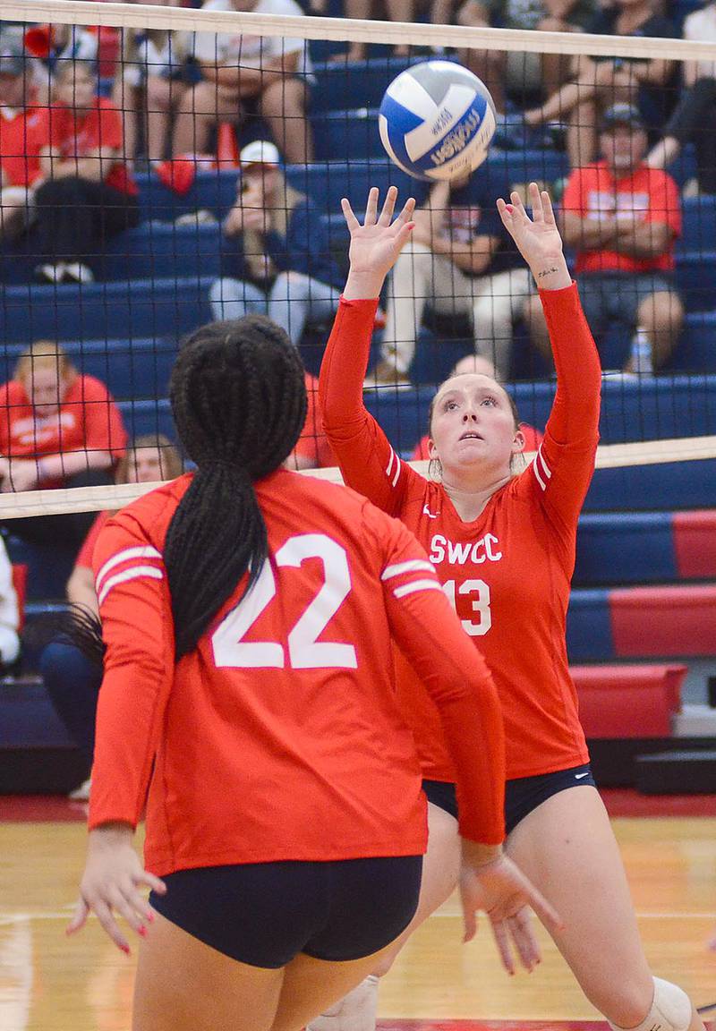 Southwestern freshman Cadence Perkins of Bedford sets up teammate Whitney Hollins (22) during Wednesday's match. Perkins finished with 21 setting assists.