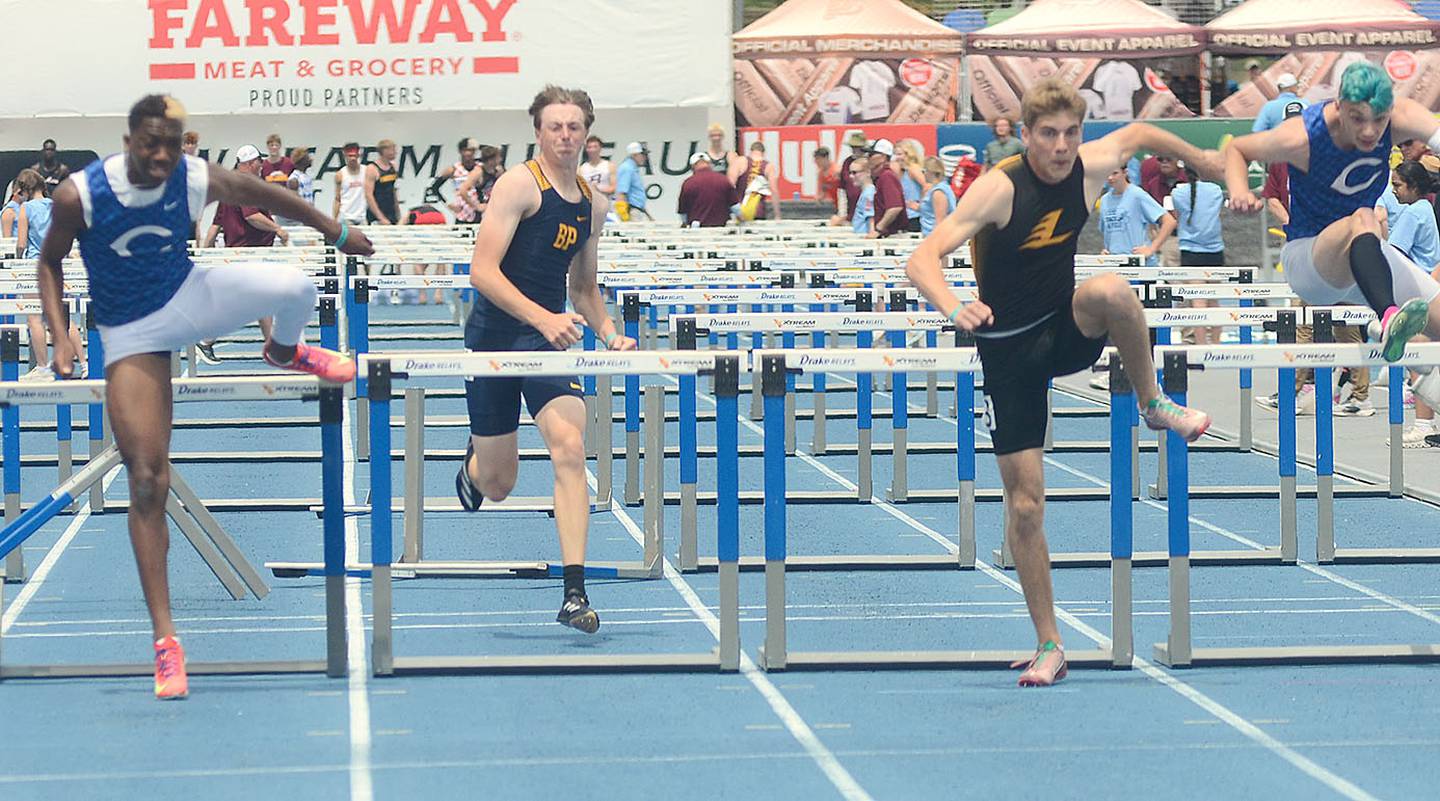 Gabe Funk of Lenox and Lamar Ceant of Columbus Junction (left) land on the track at the same time coming over the final hurdle in the 110-meter hurdles final Saturday. Funk won in 14.20 and Ceant was second in 14.23.