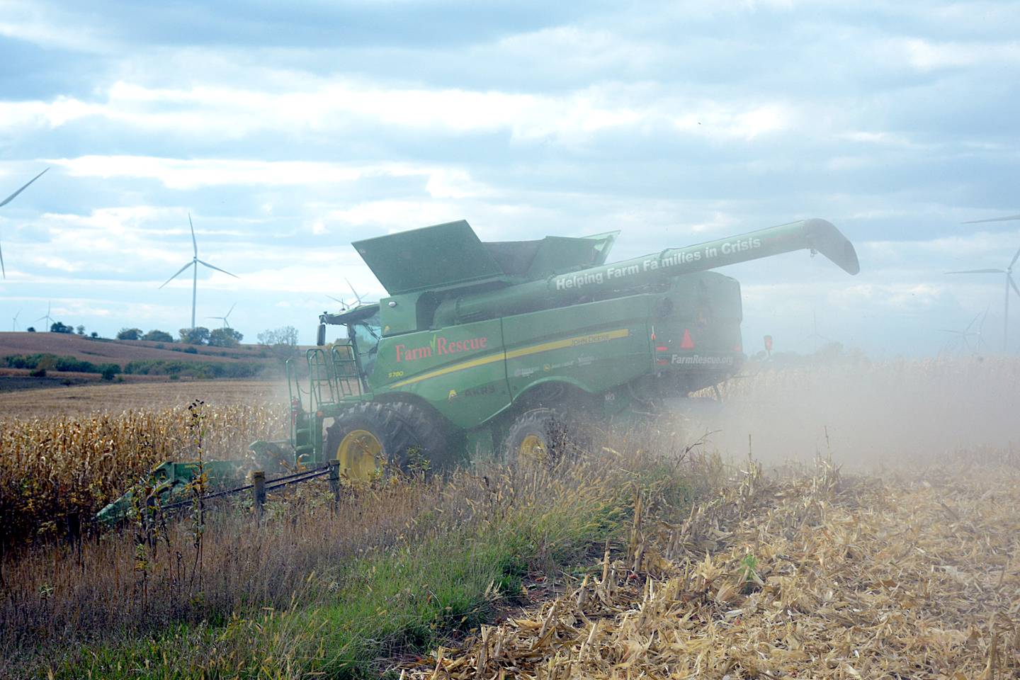 Farm Rescue's combine harvests corn on Mark Lents' farm southeast of Greenfield Wednesday, Oct. 18.