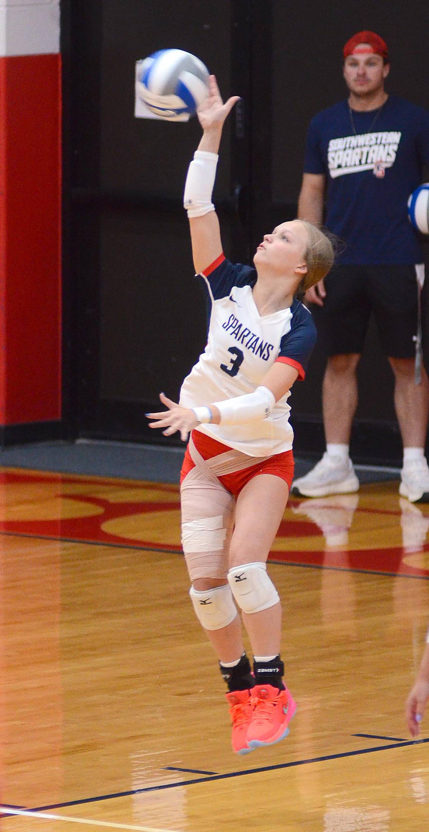 Savanna Marriot of Southwestern serves during Wednesday's home opener.