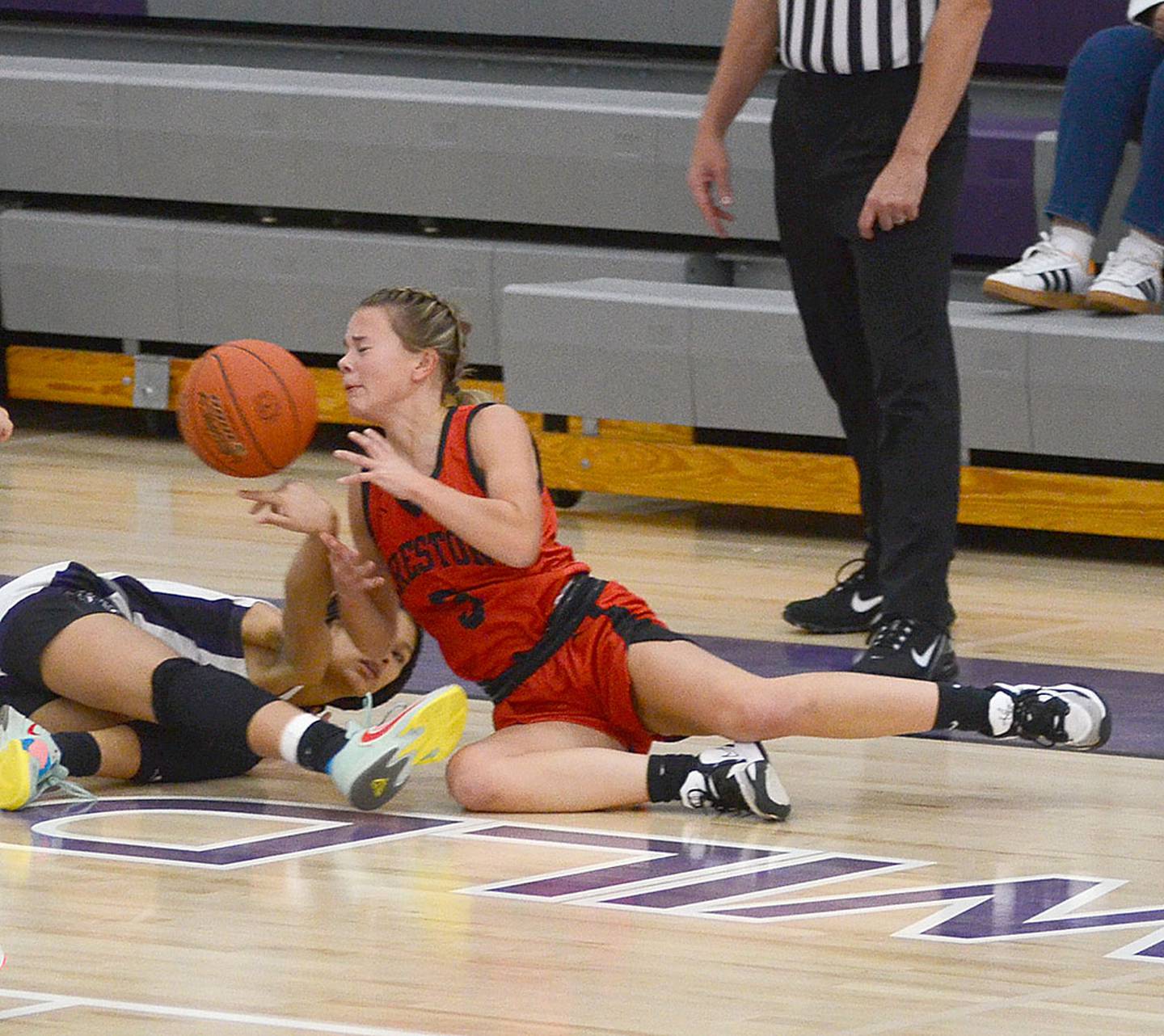 Creston's Ava Adamson dives for a loose ball during Tuesday's game at West Central Valley. Adamson scored 16 points in the 51-46 win.