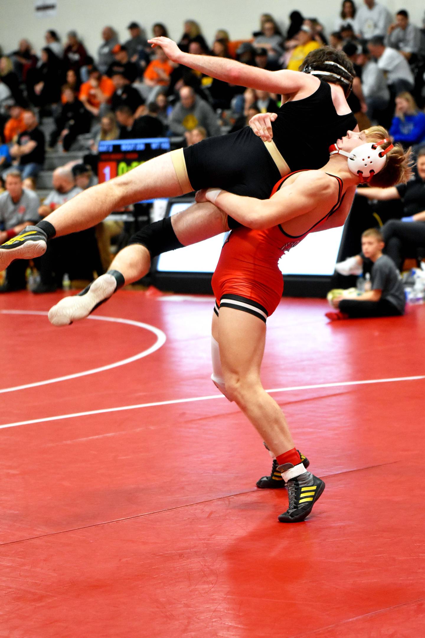 Milo Staver gets a lift on Austin Wear of Glenwood in the third-place bout. Staver won the match to earn bronze at 157.