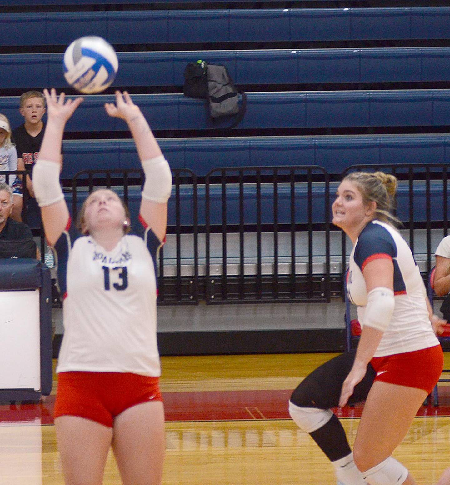Southwestern sophomore Cadence Perkins of Bedford back sets for an attack by Danyelle Steinkuehler during Wednesday's match.