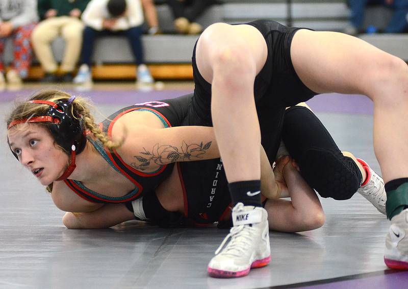 Creston senior Sydney Hoffman looks to the official in anticipation of a pin signal as she controls Kambry Gordon of Clarinda in the 115-pound third-place match Saturday at West Central Valley. Hoffman was awarded the fall in 33 seconds.