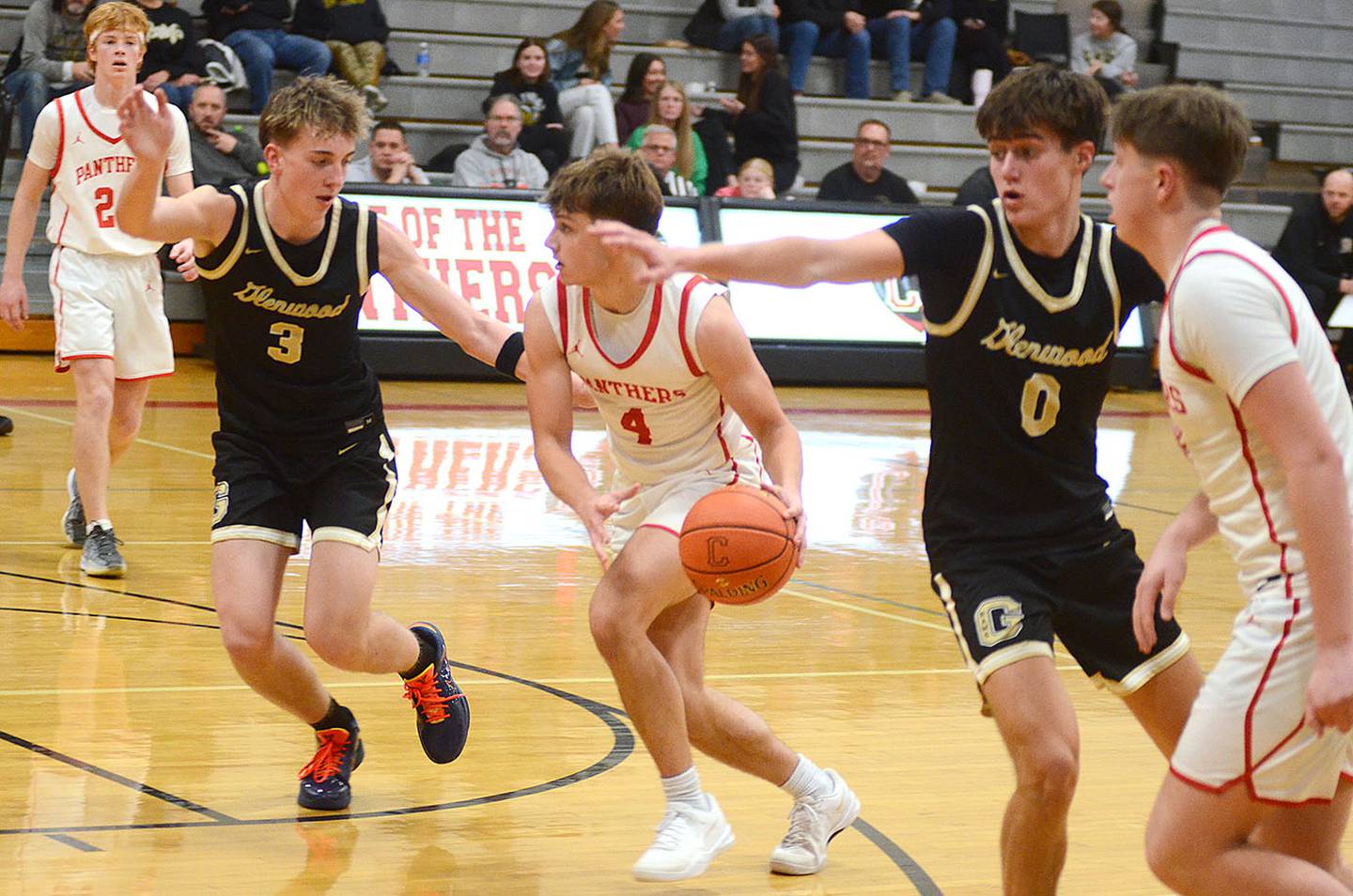 Cael Barton of Creston looks for an open teammate during Friday's game against Glenwood. Barton scored six points in the 67-29 loss.