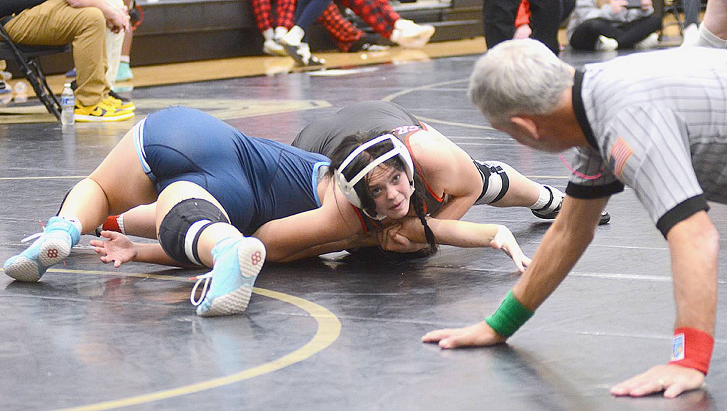 Creston 155-pounder Kora Lohoff looks at the official just before winning by fall over Peyton Katzer of Lewis Central in the consolation finals Lohoff placed third.