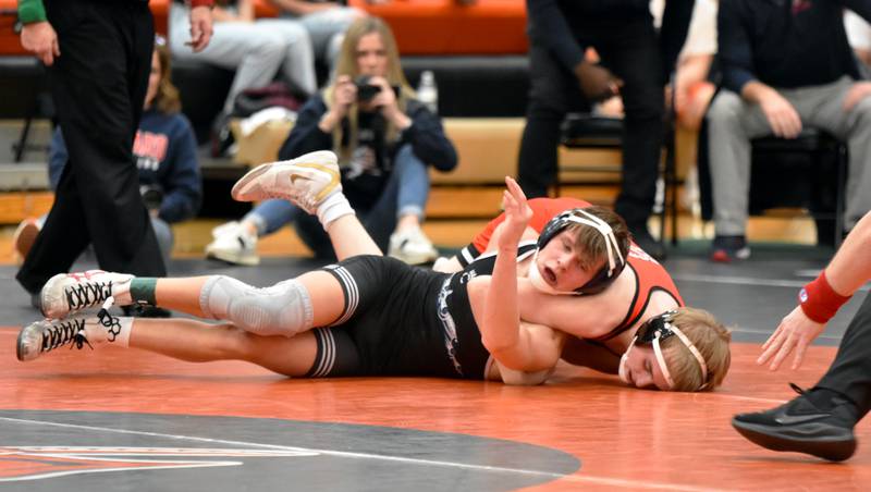 Creston freshman Landon Lillie holds Ballard’s Greyson Hedrick to the mat in a 126-pound upset Tuesday at regional duals in Sergeant Bluff-Luton.