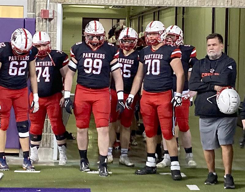 Creston coach Brian Morrison (right) waits to take the field with his players before the Class 3A semifinal game against Sioux City Bishop Heelan last season. Morrison has guided two semifinal teams and eight playoff teams in his 14 seasons as head coach.