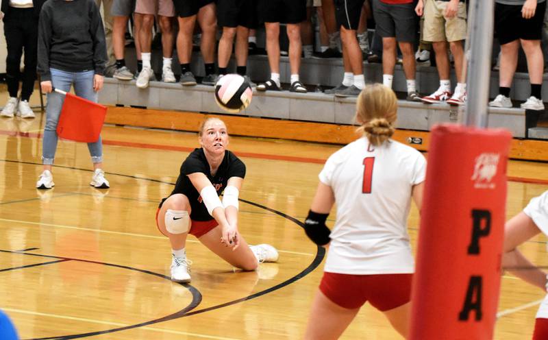 Creston libero Avery Staver goes to a knee to return a ball Tuesday in a 3-0 shut out of Centerville.