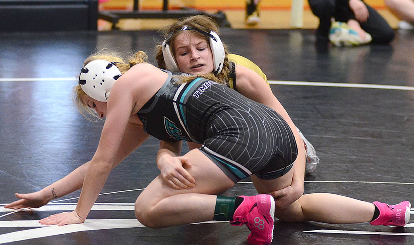 Creston freshman Eva Chesnut battles with Southwest Valley's Destiny Easley in the championship match at 100 pounds. Chesnut won by fall.