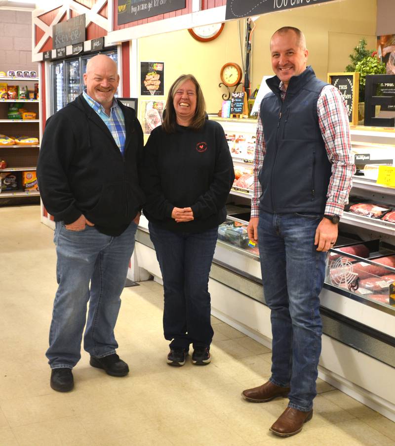 Lenox Market owners Jay and Lori Cox pose with Iowa Secretary of Agriculture Mike Naig during a tour of their store Friday, Jan. 9.