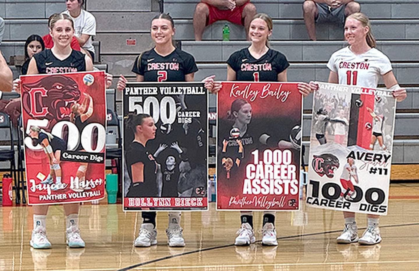 Creston players honored for reaching career milestones prior to Thursday's home match against Glenwood are, from left, Jaycee Hanson and Hollynn Rieck with 500 digs; Kadley Bailey with 1,000 assists; and Avery Staver with 1,000 digs combined at East Union and Creston.