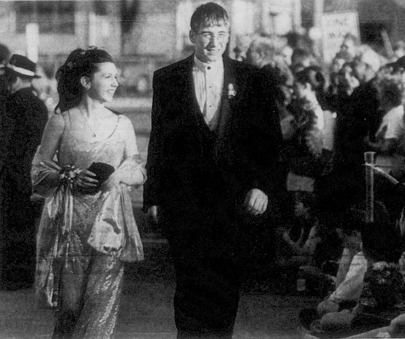 Billie Lawson and Ray Fowler, both of Creston, make their way past family and friends during their arrival at the 2001 Creston High School prom.