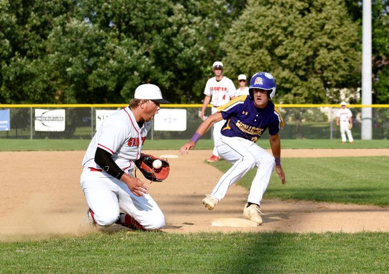 Senior third baseman Quinten Fuller fields a ball as the runner reaches third in game two against Denison-Schleswig Friday.