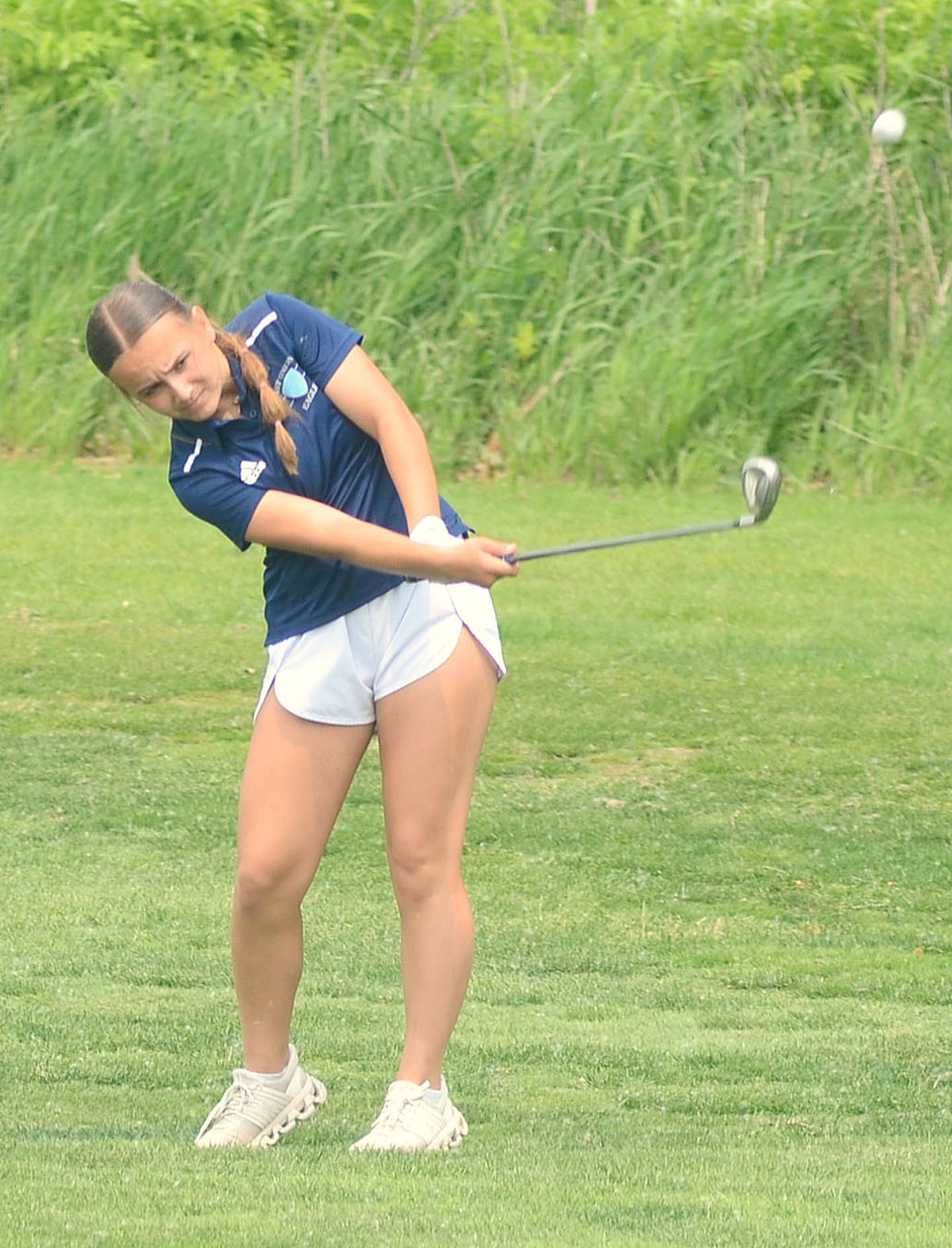 Mia Tallmon of East Union hits an approach shot during the state tournament Friday.