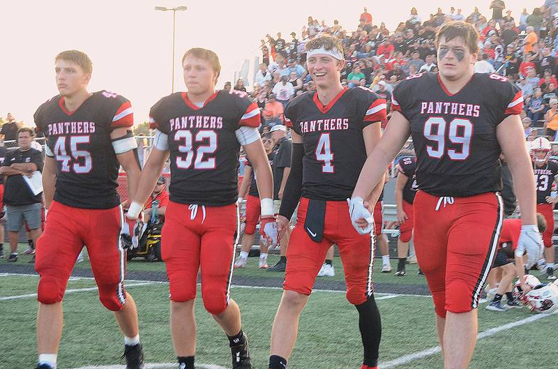 Creston captains, from left, Brennan Hayes, Austin Evans, Cael Turner and Max Chapman take the field for the coin toss last Friday against Ballard. All four are ranked high statistically in Class 3A. Hayes is sixth in rushing (493 yards) and third in all-purpose yards (749). Evans ranks 17th in total tackles (23.5). Turner leads Class 3A passers with 770 yards and third in TD passes (9). Chapman is second in tackles for loss (8.5).