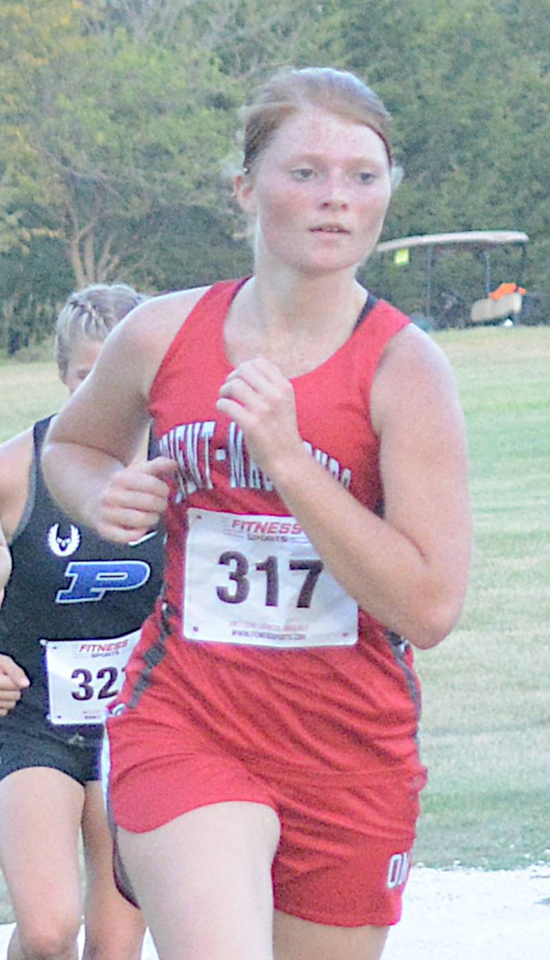 Orient-Macksburg's Bridget Bracy tackles the cross country course in a meet Thursday, Sept. 7 at Winterset.