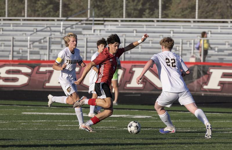 Panther junior Joaquin Flores dribbles past defenders during Thursday’s game against Centerville. Flores scored four goals during the game.