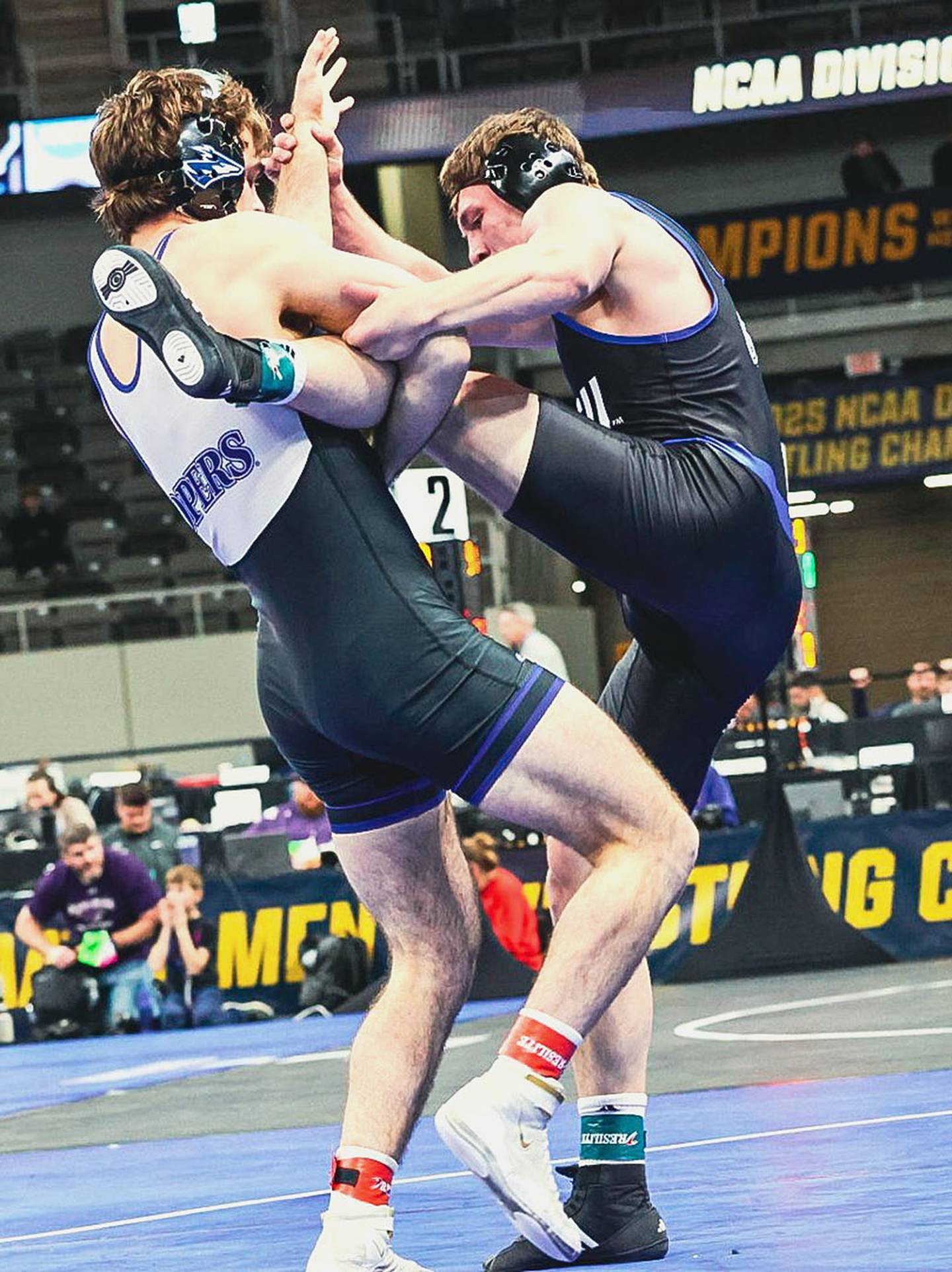Nebraska-Kearney's Jackson Kinsella (left) works to complete a takedown during an 8-7 consolation semifinal victory over Wyatt Miller of Grand Valley State.