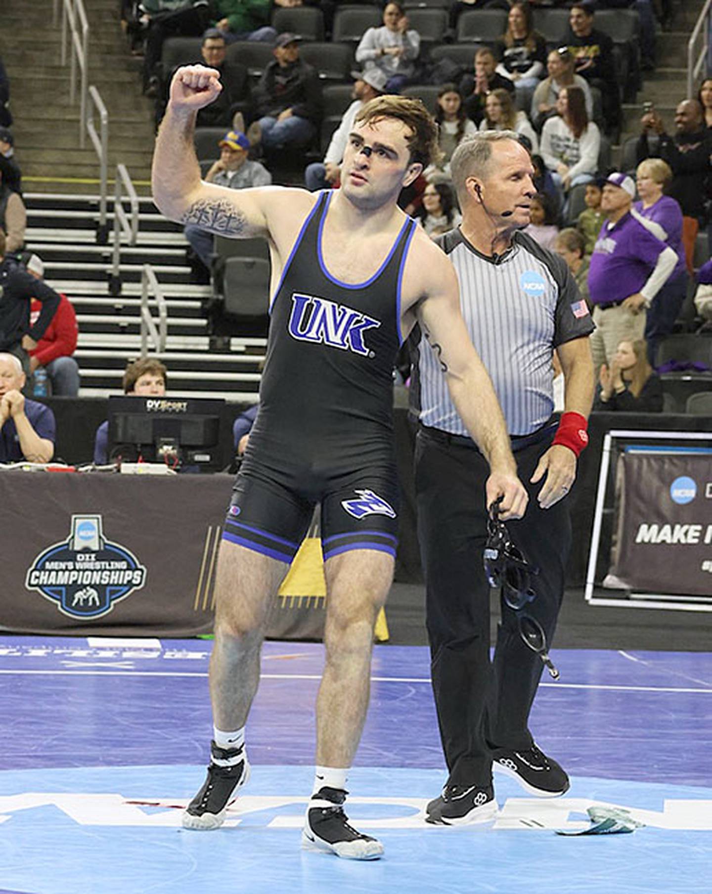 Creston native Jackson Kinsella of University of Nebraska-Kearney gestures toward the Lopers crowd after one of his three victories at the D-II national tournament.