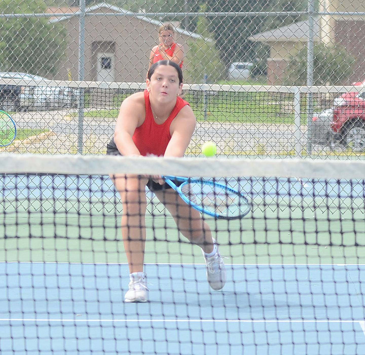 Creston's Ali Gordy reaches for a return shot at the net during her 8-4 singles win Thursday against Audubon.