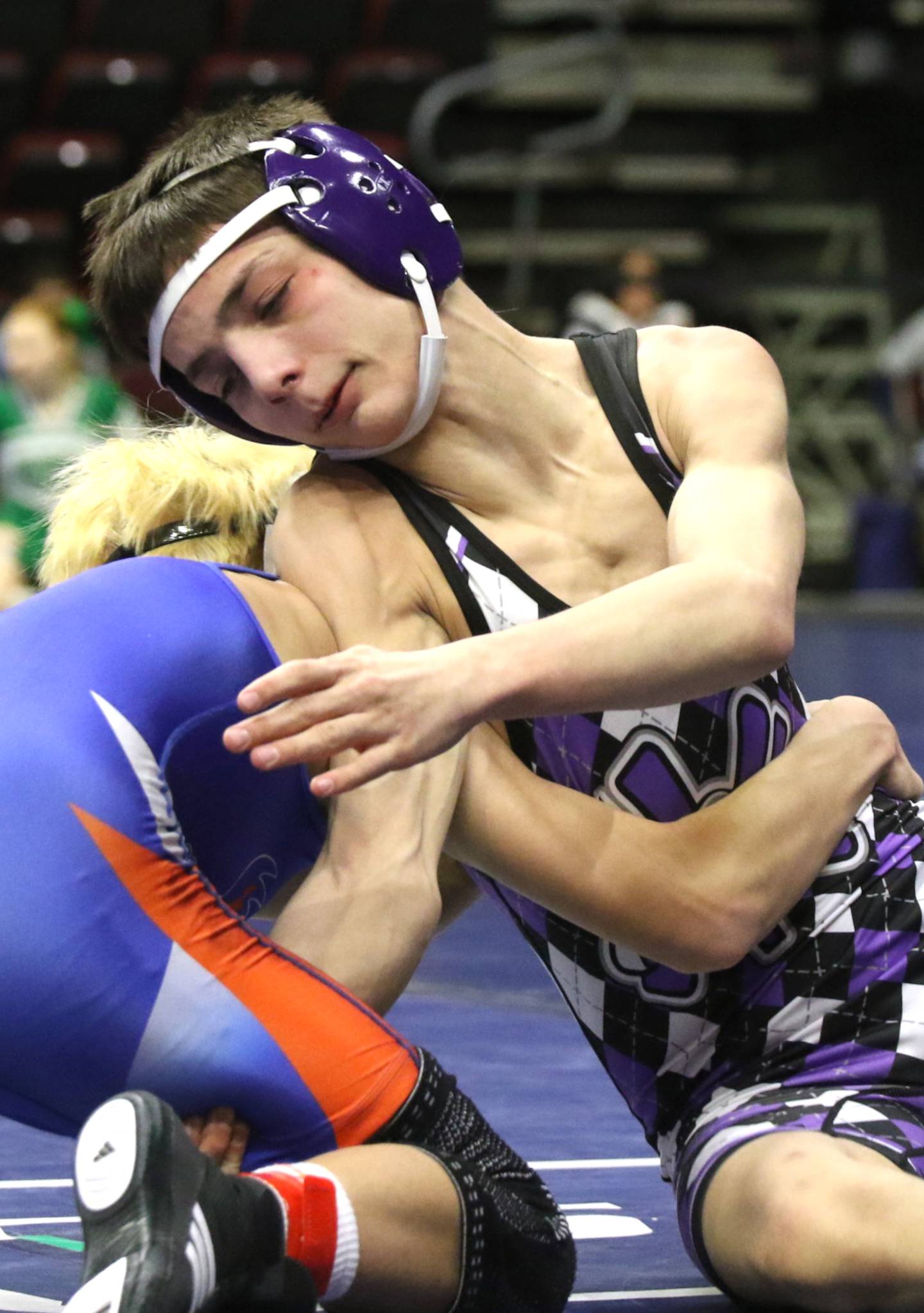 Nodaway Valley's Josh Nelson works to fend off a shot by Kaleb Bordon of Jesup in their match last Saturday at the state tournament.
