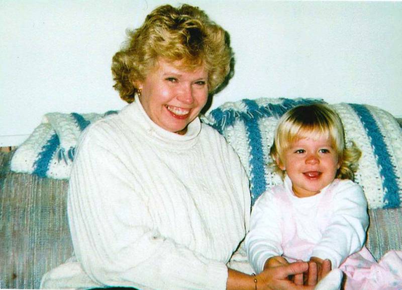 Young Erin Henze (right) smiling with grandmother Ilah Henze.
