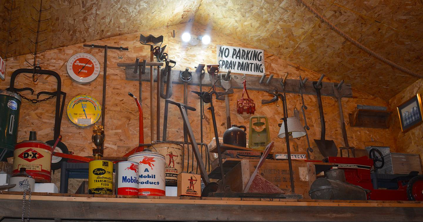 An elevated alcove in the Millers's emporium shows various historical agricultural equipment. Mobil oil products and specialized trimming tools make up a history of industry within Union County agriculture. Miller told the story of one specific tool which was used to trim graves, with a one-wheeled mower and blade on the other side.