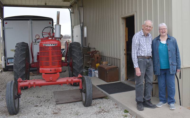 Wally and Judy Miller outside the entrance to their emporium. Beside them is a Farmall tractor, a prized machine which has been passed down generations ever since Wally worked on his family's farm as a young boy. The two plan to continue the tradition of passing the classic machine down, creating a mechanical heirloom of their family's history.
