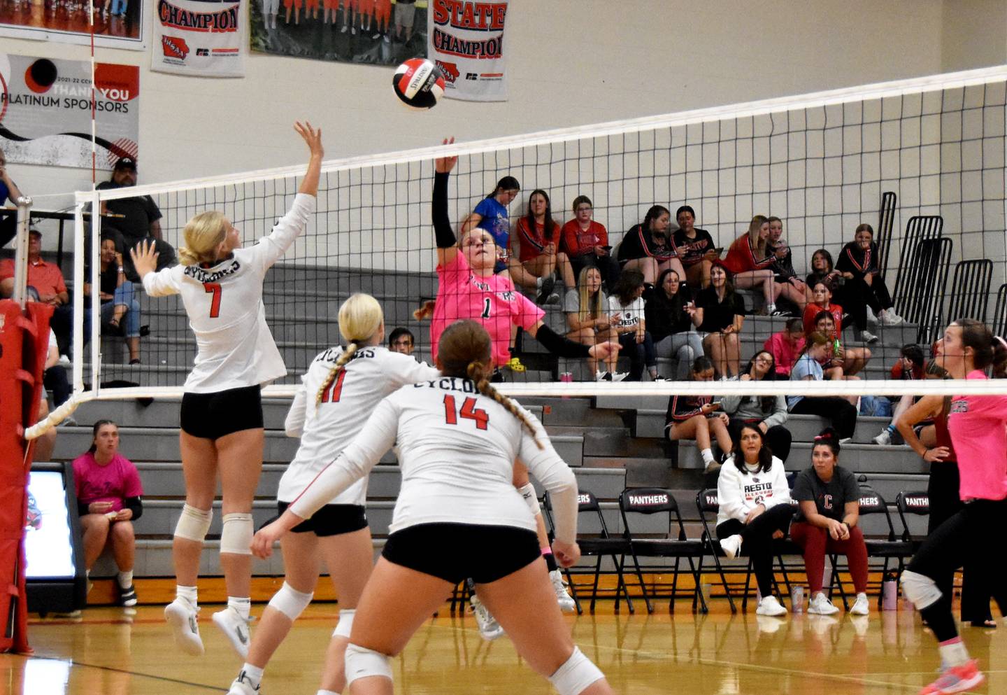 Creston junior Kadley Bailey tips the ball over Cyclone defenders. Bailey had 37 assists, 12 digs, six kills and two solo blocks during the five-set series.