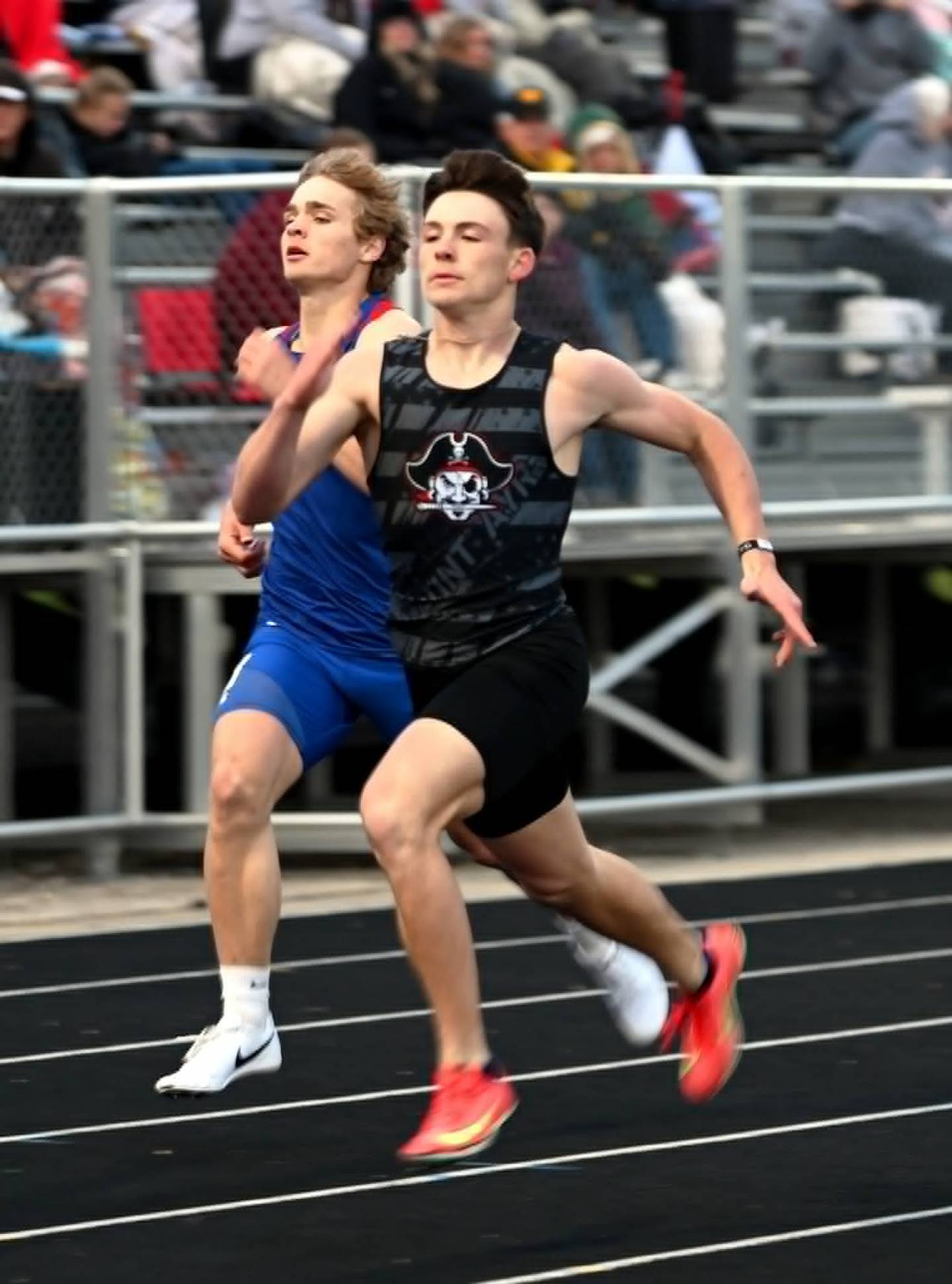 Drayden Thompson of Mount Ayr pushes past I-35's Kale Murphy for a win in the 400m dash.