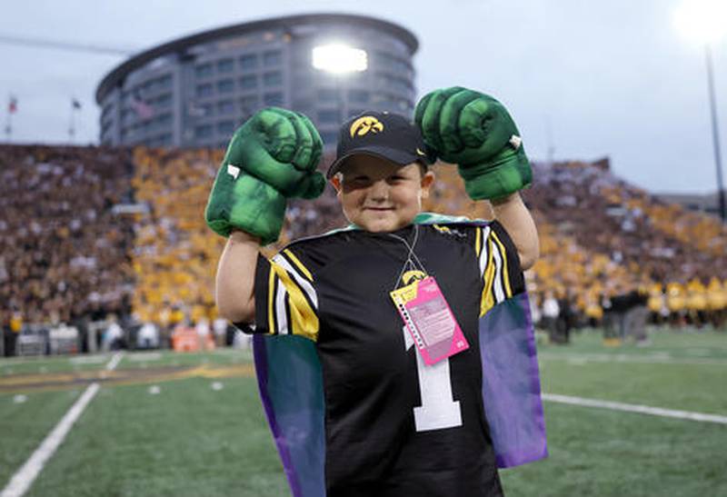 Micah Norby, 7, of Greenfield, is introduced as Kid Captain for the Iowa football team, which defeated Penn State in a close game Saturday night.
