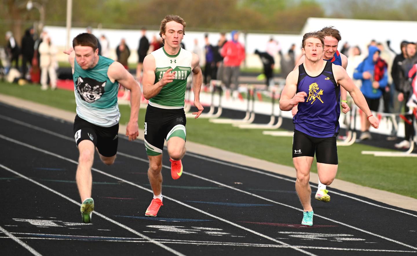 Brody Crozier of Southwest Valley, left, crosses the finish line first in the boys 100m dash.