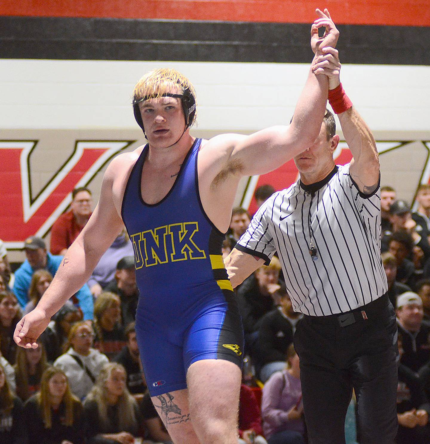 Nebraska-Kearney heavyweight Crew Howard of Clarinda, ranked No. 1 in NCAA D-II, raises his hand in victory after a 5-2 decision over Grand View's Greg Hagan, who is ranked No. 1 in NAIA.
