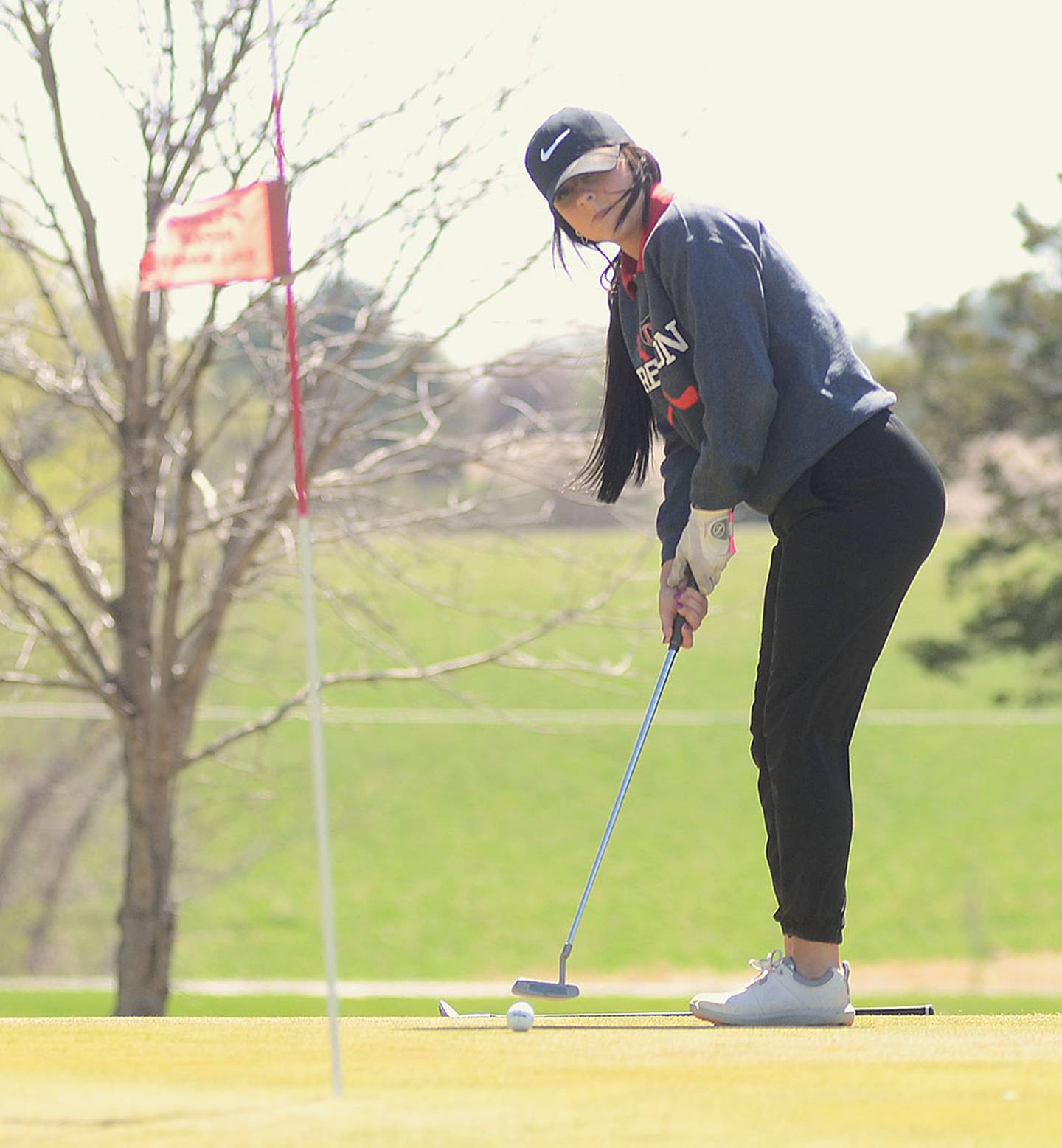 Creston's Kylie Metheny putts on the No. 3 green at Crestmoor Golf Club during Tuesday's Southwest Iowa Cup.