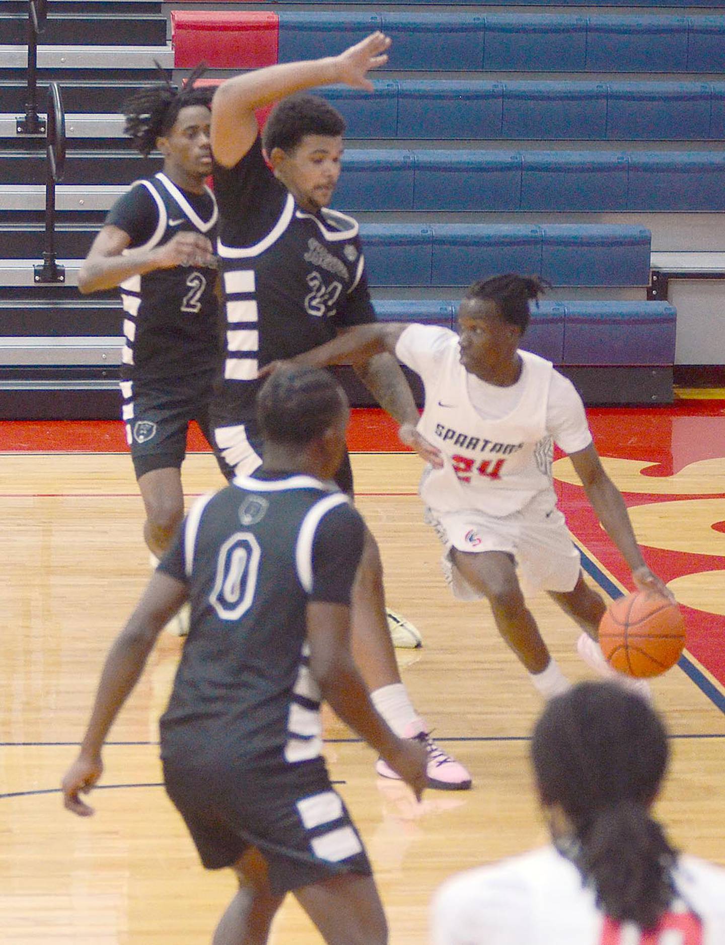 Southwestern point guard James Braddy (24) looks for a teammate as he drives the baseline against DMACC Saturday. Braddy scored four points in the 79-65 loss.
