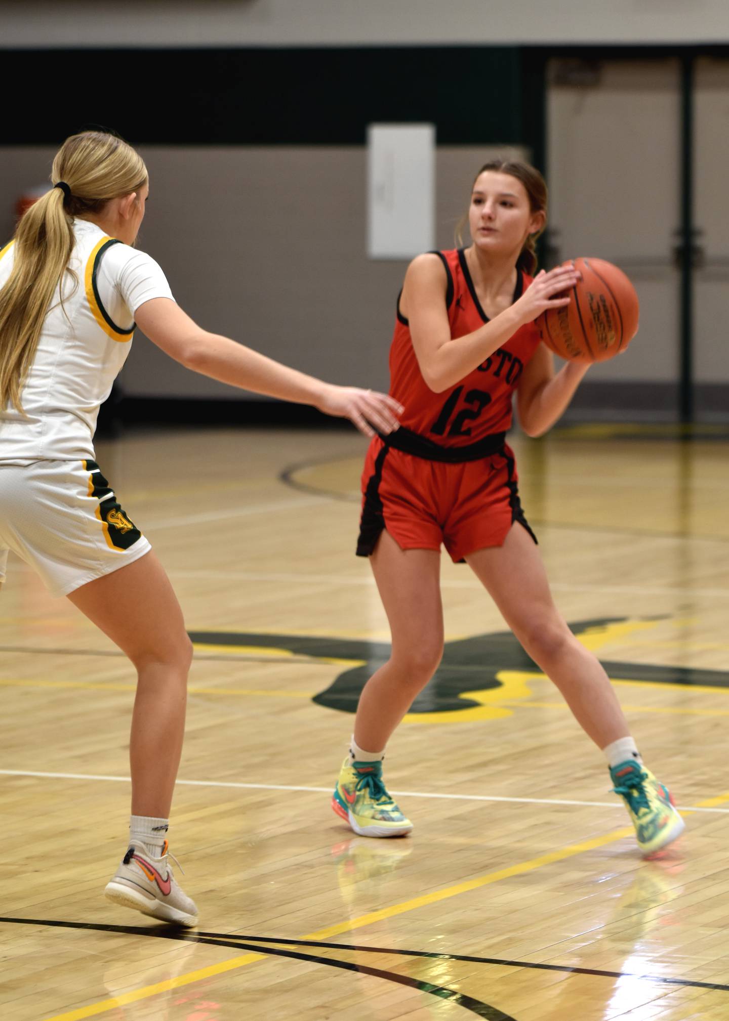 Lydia Goins keeps the ball moving against St. Albert.